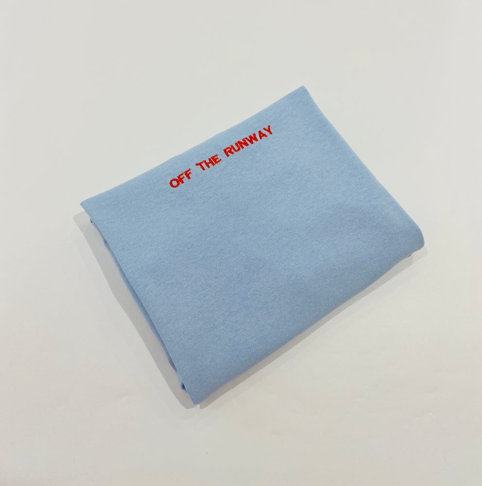 Classic “OFF THE RUNWAY” Logo T-Shirt. Light Blue.